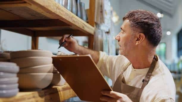Multiple delivery vans parked in row representing transportation in logistics.