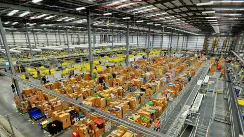 Rows of packages and goods organized across a fulfillment center.