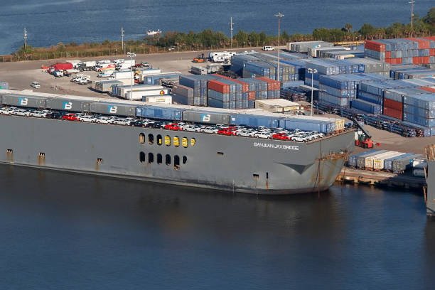 Roll on roll off vessel with vehicles at port, showing drayage and short haul connections for automotive logistics.
